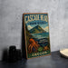 A vintage-style metal sign for the Cascade Head Marine Reserve, featuring an illustration of an octopus and a mountain landscape.
