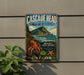 A vintage-style metal sign for the Cascade Head Marine Reserve in Oregon, featuring an illustration of an octopus, a mountain, and marine life.