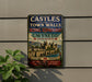 A metal sign on a wall that reads "CASTLES AND TOWN WALLS KING EDWARD GYNEDD UNITED KINGDOM" with a castle illustration below it.