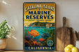 A vintage-style metal sign for Catalina Island Marine Reserves, featuring illustrations of marine life and a scenic coastal landscape.