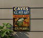 a vintage-style sign that reads "CAVES and ICE AGE ART in the SWABIAN JURA GERMANY" with an illustration of a cave and a horse.