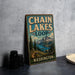 A vintage-style metal sign for Chain Lakes Loop in Washington, featuring a scenic mountain landscape.