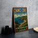 A vintage-style sign for Chance Cove Provincial Park, New Brunswick, Labrador, featuring a scenic coastal landscape with cliffs, a beach, and a boat on the water.