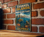 A vintage-style metal sign for the Channel Islands National Marine Sanctuary in California, featuring illustrations of sea creatures and a scenic ocean landscape.