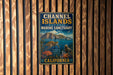 A vintage metal sign for Channel Islands National Marine Sanctuary in California, featuring illustrations of marine life and a scenic landscape.