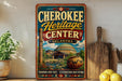 A vintage-style sign for the Cherokee Heritage Center in Oklahoma, featuring a colorful illustration of the center's architecture and surrounding landscape.