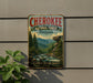 A vintage-style metal sign for the Cherokee National Forest in Tennessee, featuring a scenic mountain landscape with a river and pine trees.