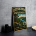 A vintage metal sign for Chester-Blandford State Forest, featuring a scenic landscape with pine trees, a river, and mountains.