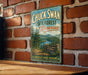 A vintage-style sign for Chuck Swan State Forest in Tennessee, featuring a scenic landscape with pine trees, a river, and mountains.