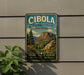 a vintage-style metal sign with a scenic mountain landscape, mounted on a wall.