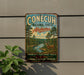 A vintage-style metal sign for Conecuh National Forest in Alabama, featuring a scenic illustration of a forest landscape with a deer.