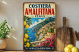 A vintage-style metal sign with a colorful illustration of the Amalfitana island in Italy, featuring a scenic view of the coastline and buildings.