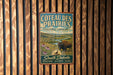 a vintage-style metal sign with a buffalo and flowers, mounted on a wooden wall.