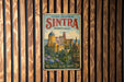 A vintage-style metal sign with the text "CULTURAL LANDSCAPE OF SINTRA PORTUGAL" and an illustration of a castle or palace surrounded by trees and flowers.