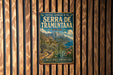 A vintage-style metal sign with the text "CULTURAL LANDSCAPE OF THE SERRA DE TRAMUNTA" and "SPAIN" is displayed on a wooden wall.