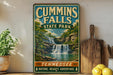 A vintage-style sign for Cummins Falls State Park in Tennessee, featuring a scenic image of a waterfall surrounded by lush greenery.