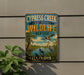 A vintage-style metal sign for the Cypress Creek National Wildlife Refuge in Illinois, featuring an illustration of wildlife in a natural setting.