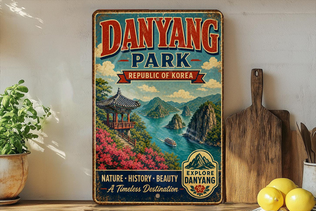 A vintage-style metal sign for Danyang Park, the Republic of Korea, featuring a scenic landscape with mountains, a pagoda, and a river.