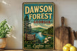 A vintage metal sign for Dawson Forest in Georgia, featuring a scenic landscape with pine trees, a river, and mountains.