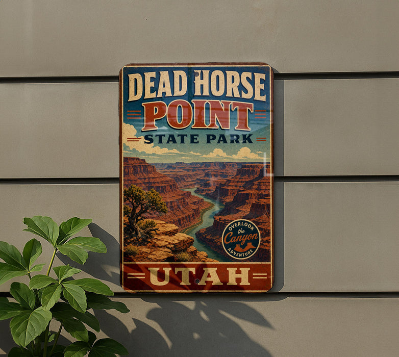 A vintage-style sign for Dead Horse Point State Park in Utah, featuring a scenic image of the Grand Canyon.