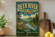 A vintage-style metal sign for Deer River State Forest in New York, featuring a scenic illustration of a deer in a forest setting with a river flowing through it.