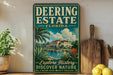 A vintage-style sign for Deering Estate, Florida, featuring a tropical landscape with palm trees and a building, is displayed on a shelf next to a wooden cutting board and some lemons.