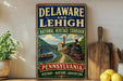 A vintage-style sign for the National Heritage Corridor in Delaware and Lehigh, Pennsylvania, featuring an illustration of a train, bridge, and river.