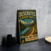 A vintage-style metal sign advertising the Deschutes River Trail in Oregon, featuring a scenic mountain landscape and a path leading through the woods.