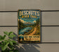 A vintage-style metal sign advertising the Deschutes River Trail in Oregon, featuring a scenic mountain landscape with a river and forest.