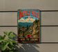 A vintage-style metal sign for Devil's Path, a New York hiking trail, mounted on a wall next to a plant.
