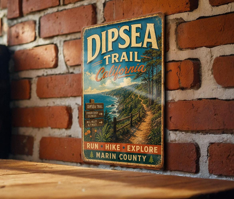 A vintage metal sign for the Dipsea Trail in California, featuring a scenic illustration of a trail surrounded by trees and a body of water.