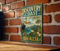 A vintage-style metal sign with a tropical landscape and a toucan, mounted on a brick wall.