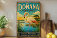 a vintage-style sign for Donana, Spain, with a pink flamingo and a scenic landscape.