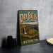 A vintage-style sign for Dry Falls State Park in Washington, featuring a scenic image of the falls and surrounding landscape.