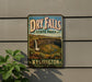 A vintage-style sign for Dry Falls State Park in Washington, featuring a scenic image of the falls and surrounding landscape.