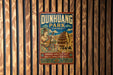 A vintage metal sign for Dunhuang Park in China, featuring an illustration of a temple and a woman playing a musical instrument.