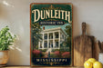 a vintage-style sign for Dunleith Historic Inn in Mississippi, with a large illustration of a historic building surrounded by flowers and greenery.