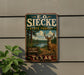 A metal sign with the text "E.O. SIECKE STATE FOREST" and an illustration of a deer in a forest setting.