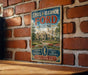 A vintage-style sign for Edsel & Eleanor Ford House, featuring a large illustration of the house and the Ford logo, mounted on a brick wall.