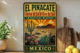 a vintage-style sign for the El Pincactus Biosphere Reserve in Mexico, with a desert landscape and cacti depicted on the sign.