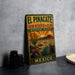 A vintage-style metal sign with a desert landscape and cacti, advertising the El Pincaté Biosphere Reserve in Mexico.