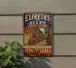 A metal sign on a wall that reads "Elfreth's Alley Historic District Philadelphia Pennsylvania" with an illustration of a street scene.