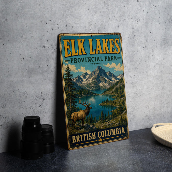 A vintage-style metal sign for Elk Lakes Provincial Park in British Columbia, featuring a scenic mountain landscape with a deer in the foreground.