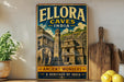 A vintage-style poster advertising Ellora Caves in India, featuring an illustration of the ancient ruins and a large elephant.