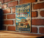 A vintage-style metal sign with the text "EPISCOPAL COMPLEX OF THE EUPHRASIAN BASILICA IN THE HISTORIC CENTRE OF POREC CROATIA" is displayed on a brick wall.