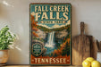 a vintage-style sign for Fall Creek Falls State Park in Tennessee, with a waterfall and forest scenery.