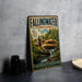 A vintage-style metal sign for Fallingwater, Pennsylvania, featuring an illustration of the house and waterfall.