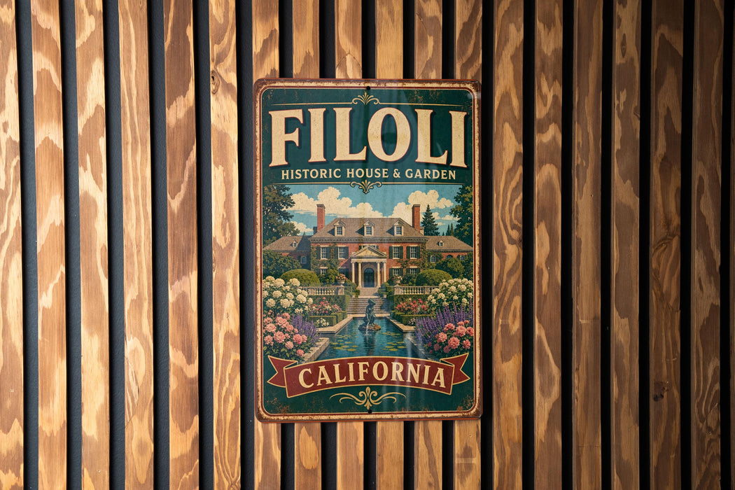 A vintage-style metal sign with the text "FILOLI HISTORIC HOUSE & GARDEN" and "CALIFORNIA" is displayed on a wooden fence.