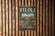 A vintage-style metal sign with the text "FILOLI HISTORIC HOUSE & GARDEN" and "CALIFORNIA" is displayed on a wooden fence.