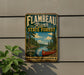 A vintage-style metal sign for Flambéau River State Forest, featuring a scenic illustration of a lake, forest, and canoe.